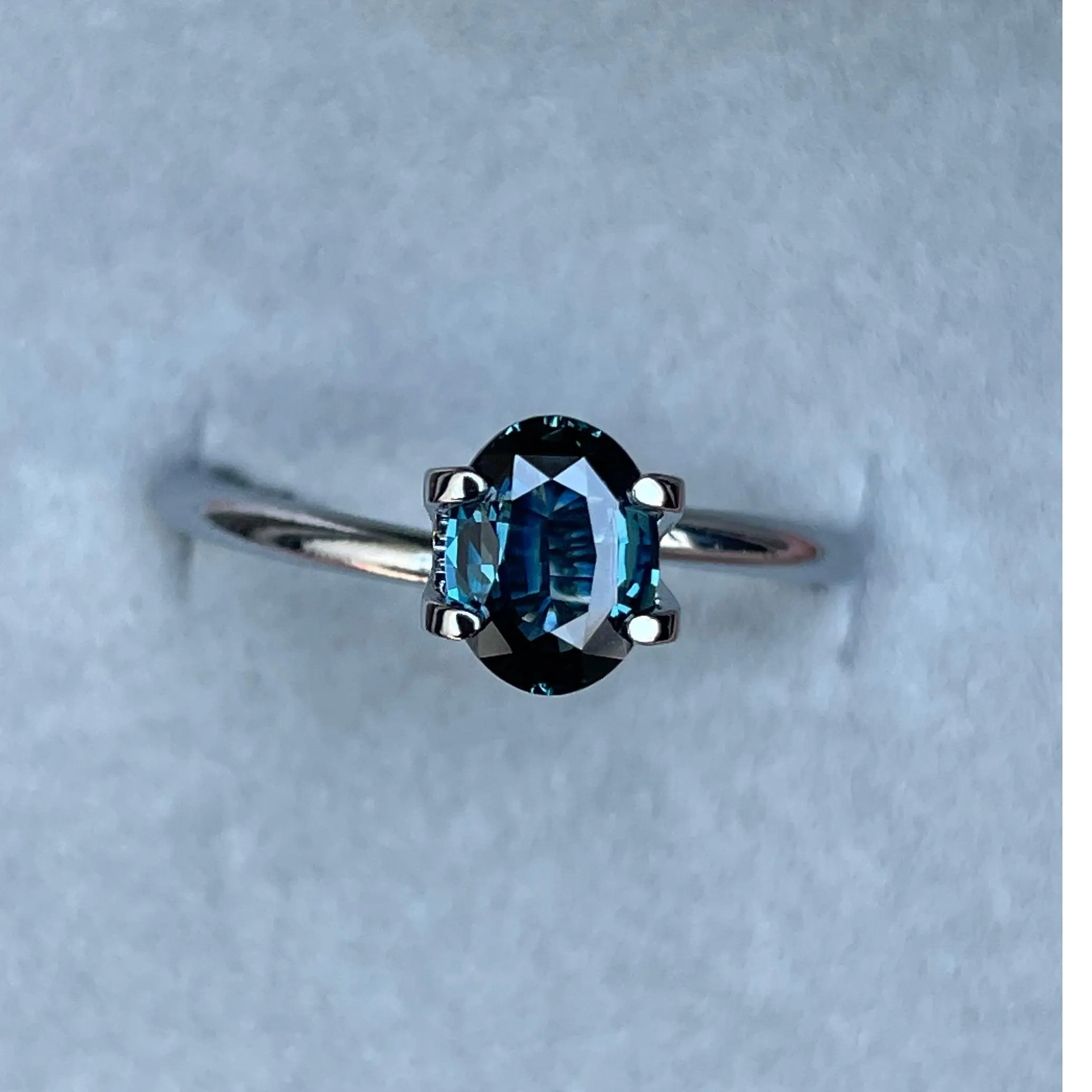 This 1.03 crt teal Sapphire is well cut to bring out the best colour and lustre, and has a perfect colour blend.